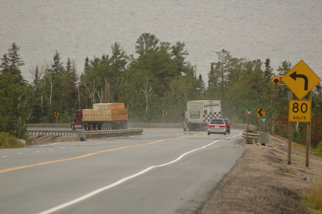 Trucks on highway corner