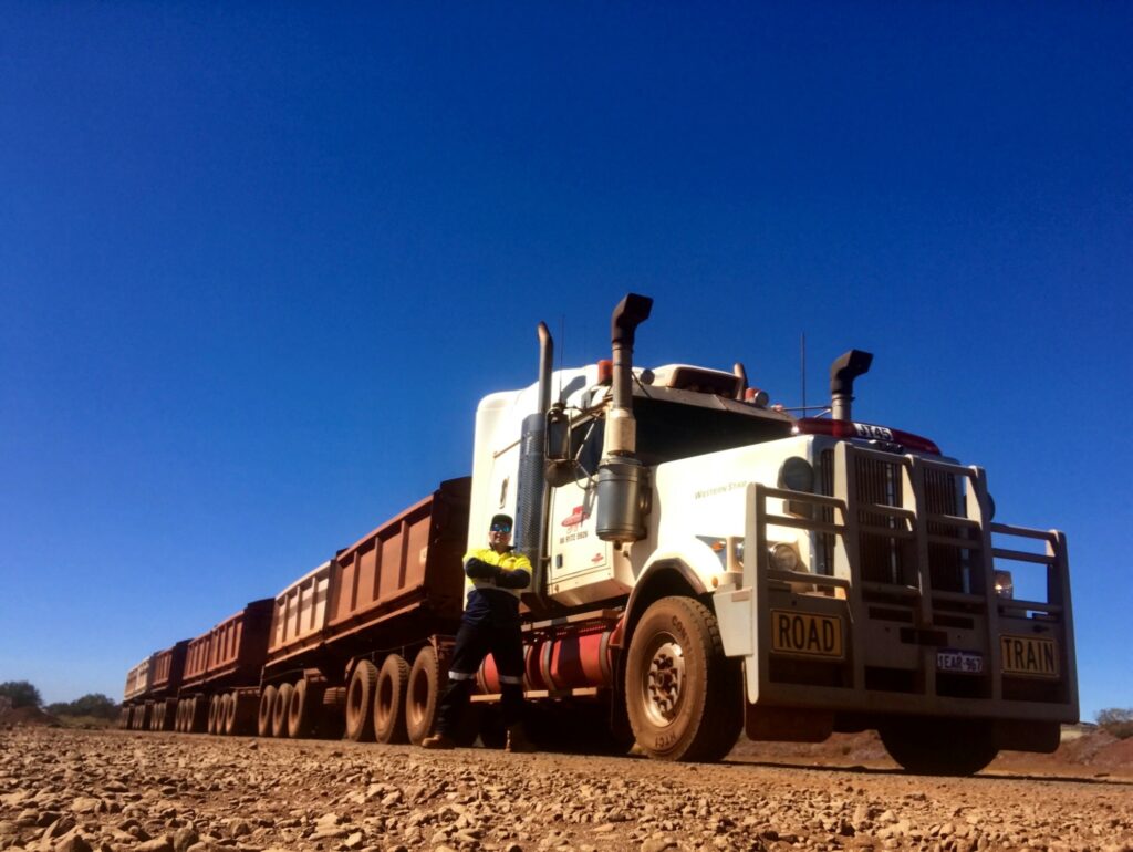 Andrew Worth with a road train in the Australian Outback