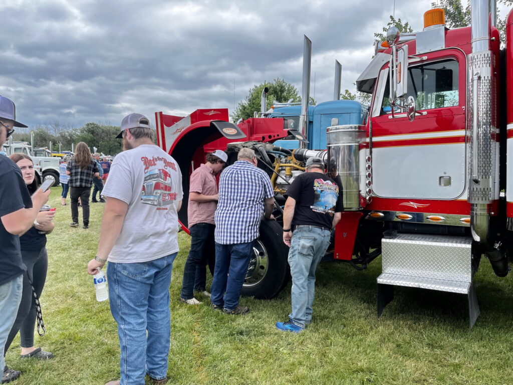 Crowds examine classic trucks at Clifford Truck Show